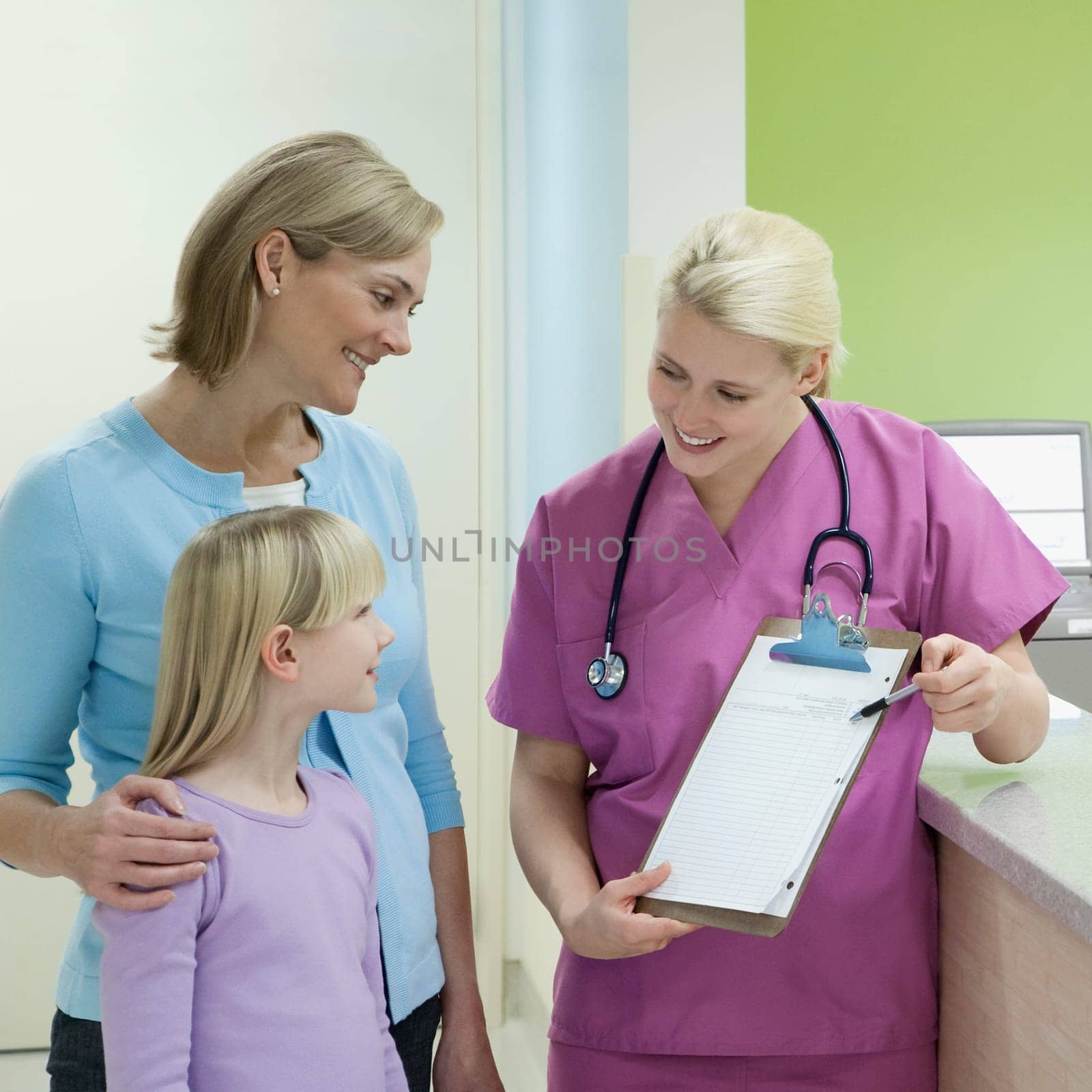 Female doctor showing medical chart to patients