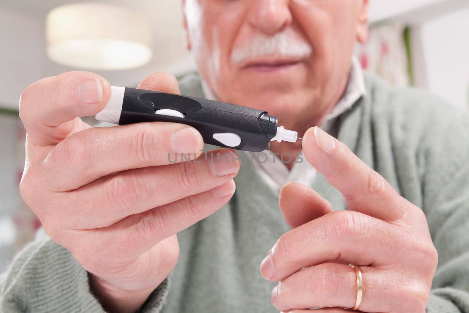 Man testing his blood sugar level