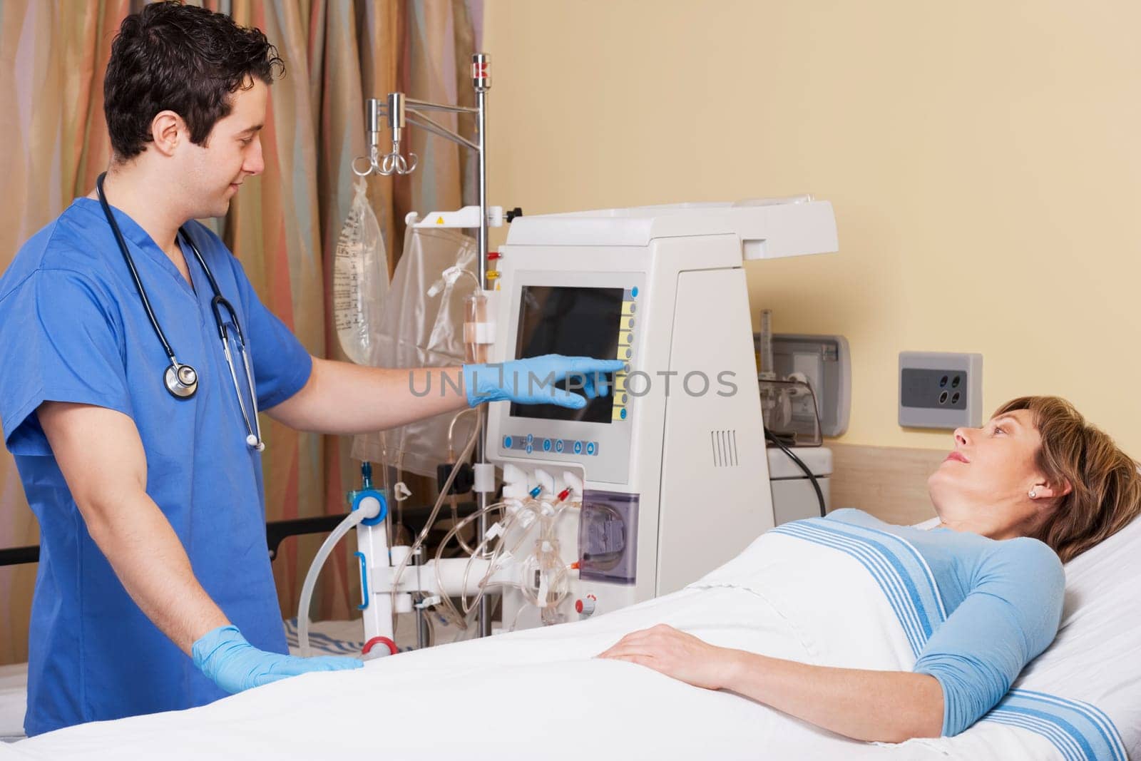 Doctor working on a cardiac monitor screen