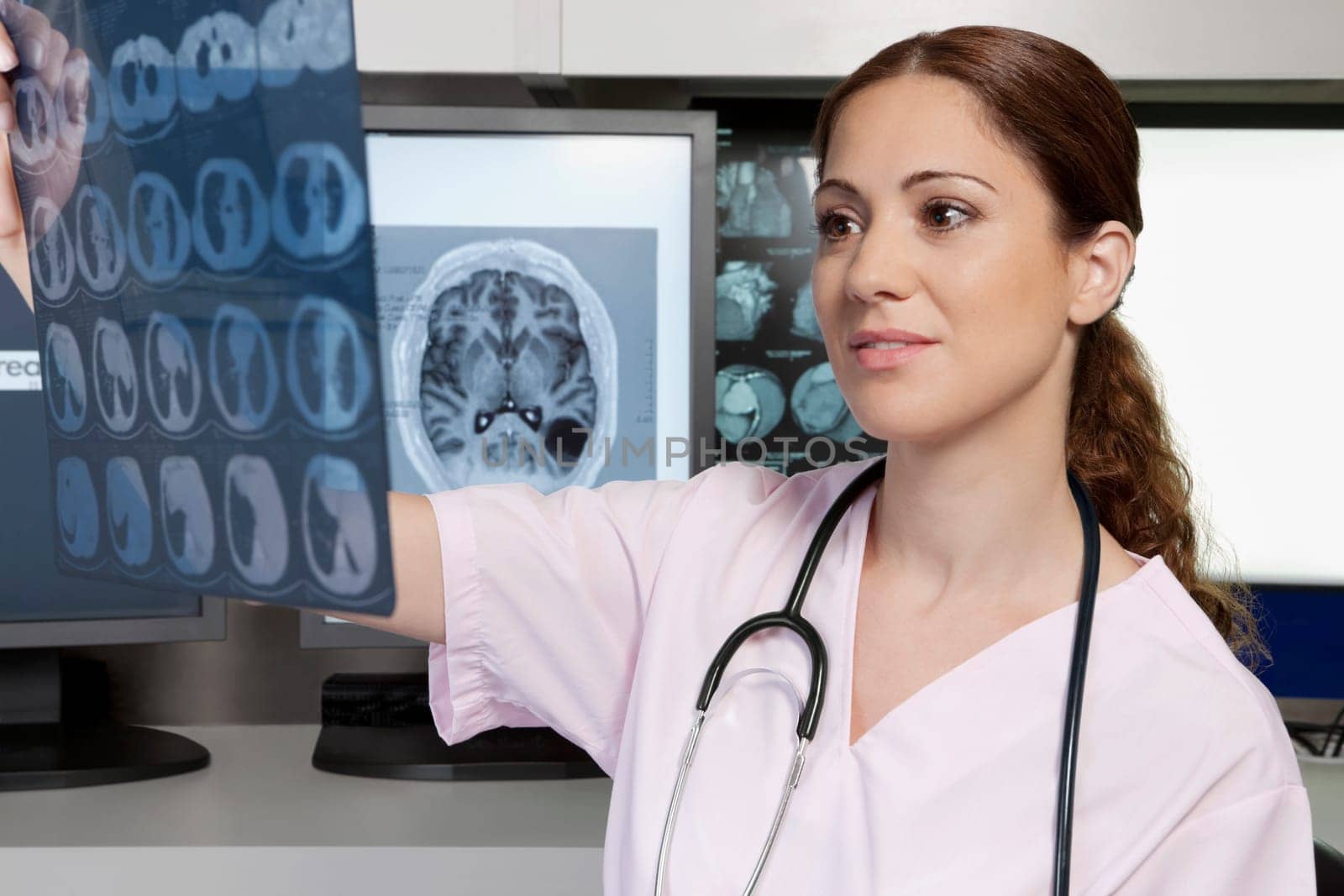 Female doctor examining an x_ray report