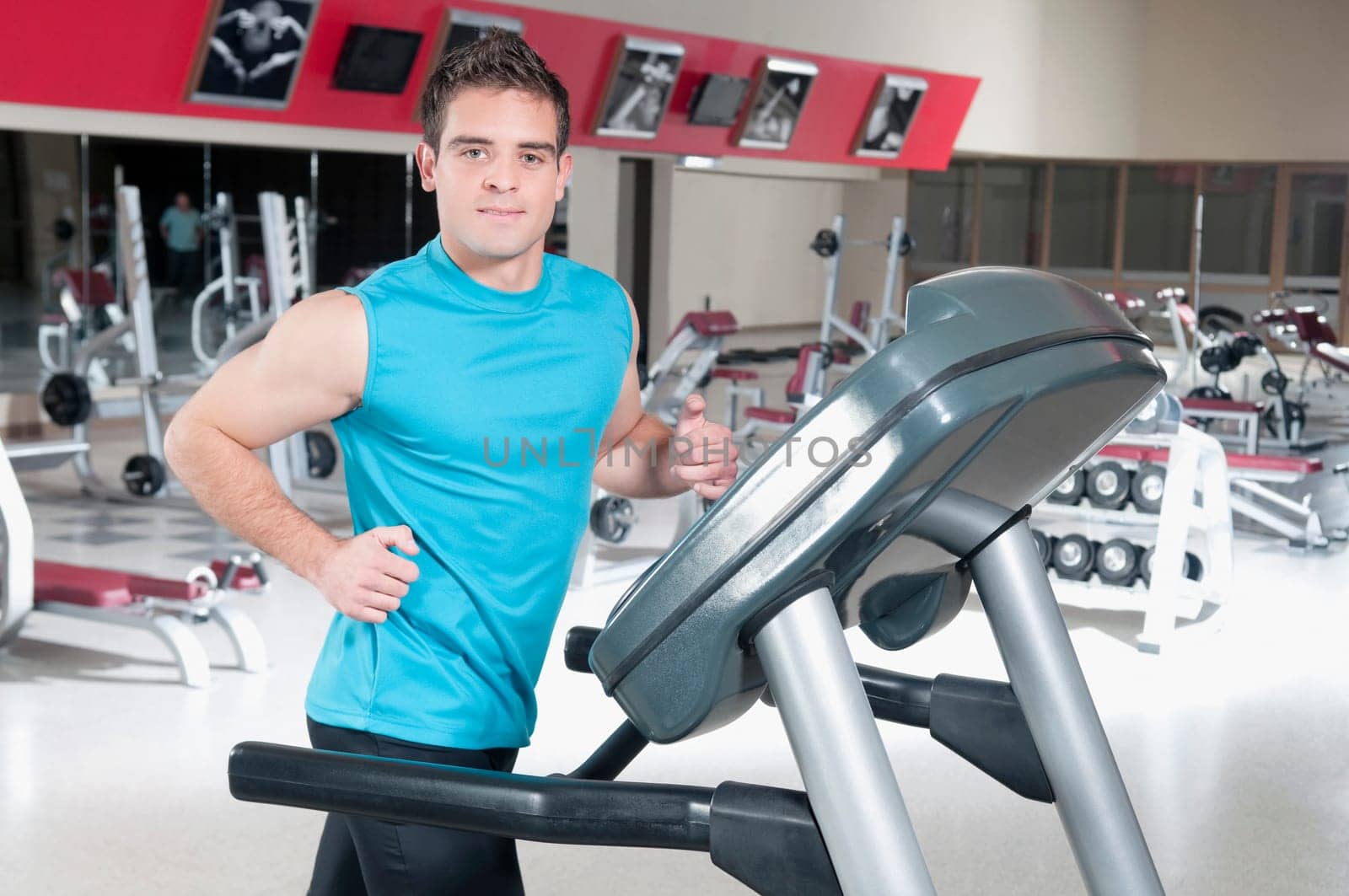 Portrait of a man running on a treadmill