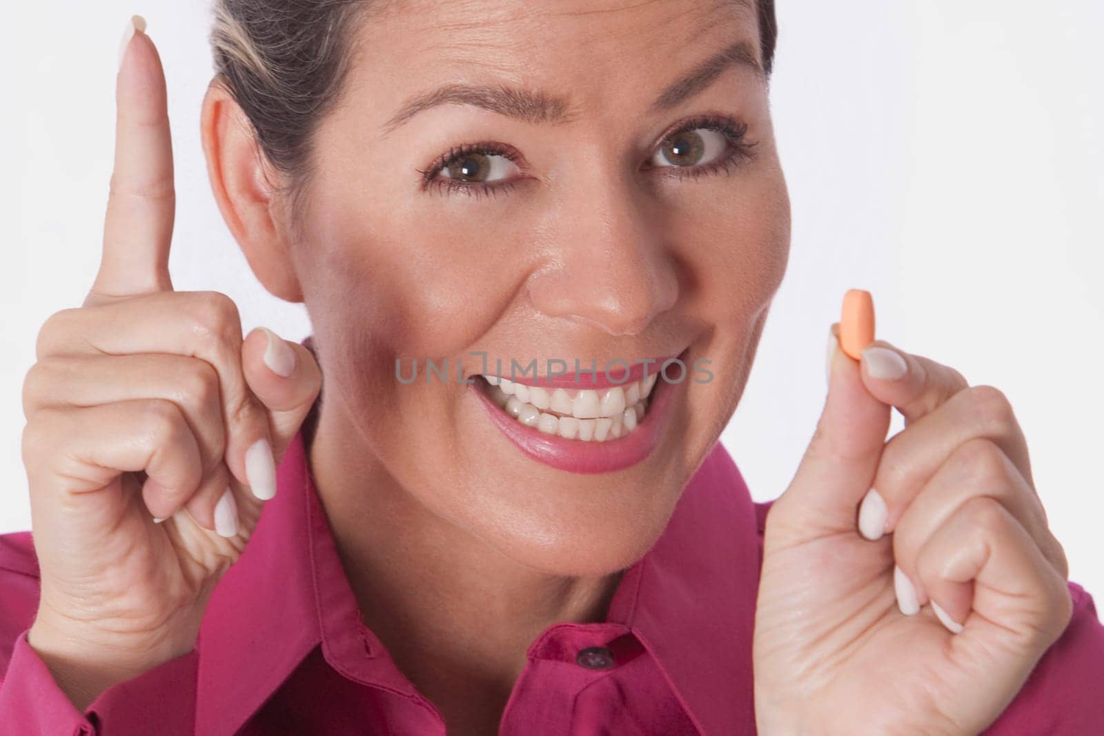 Woman holding a pill