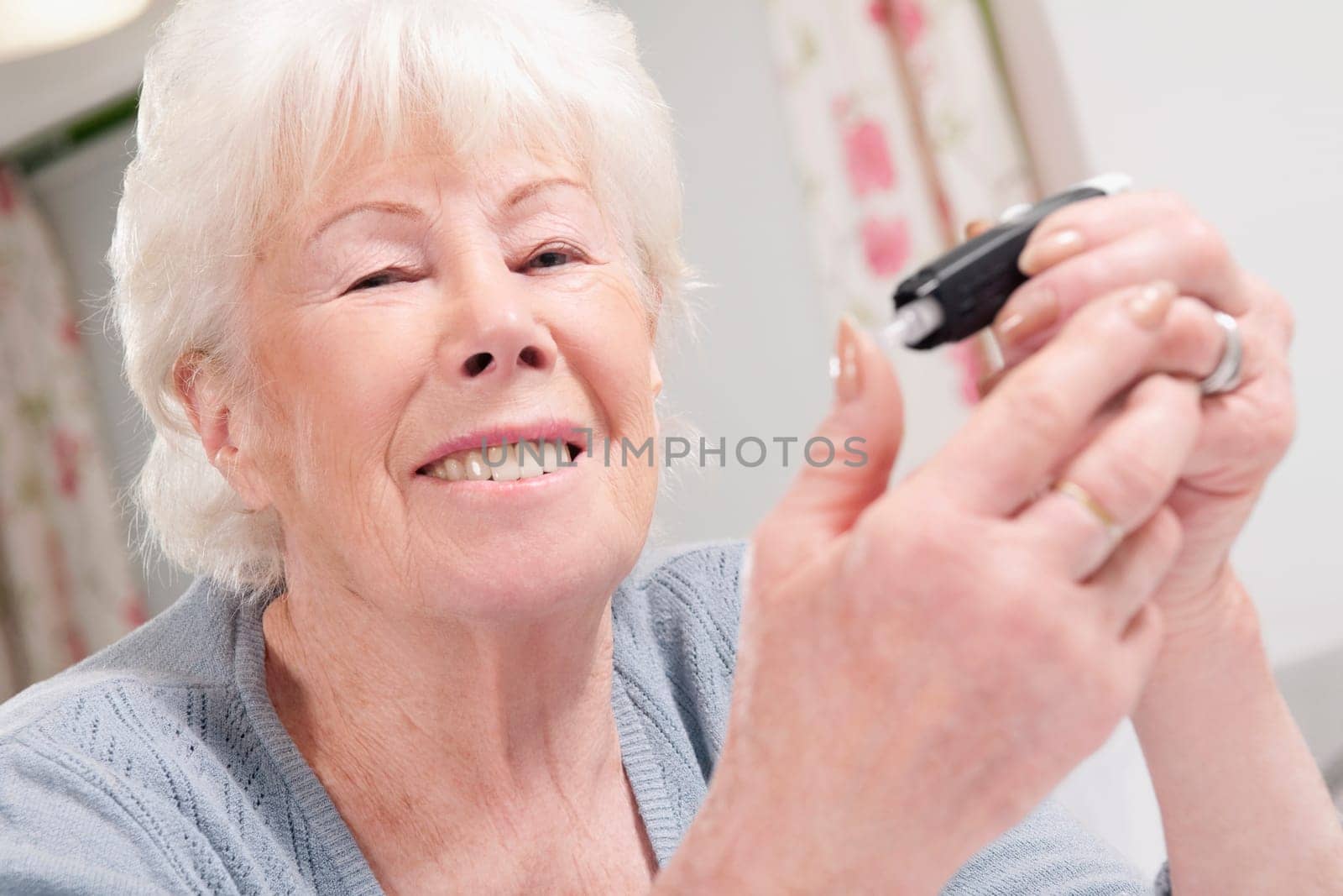 Woman testing her blood sugar level