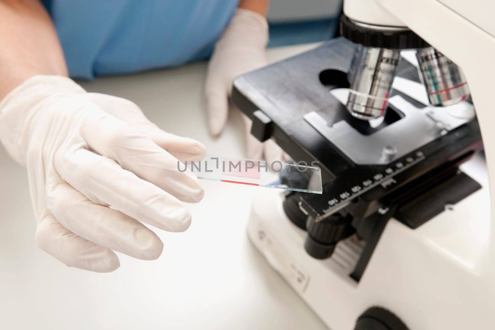 Female lab technician analyzing a sample in a laboratory