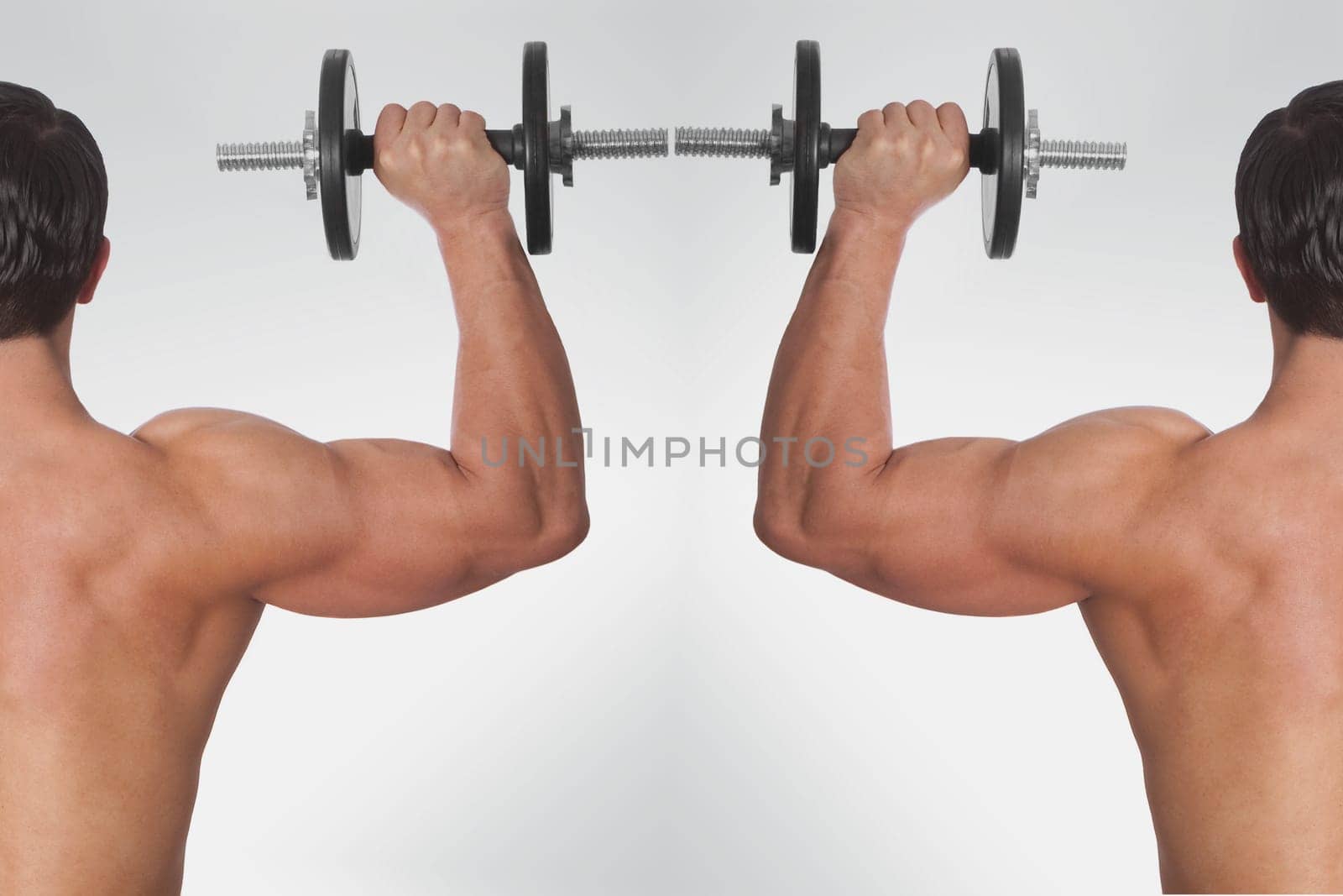 Rear view of two men exercising with dumbbells