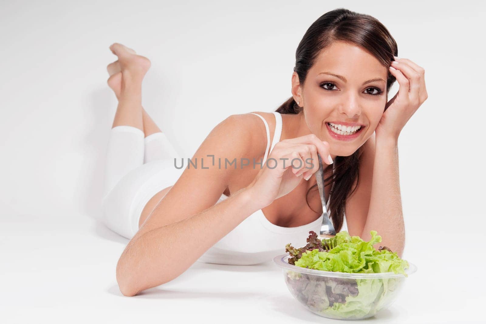 Woman eating salad