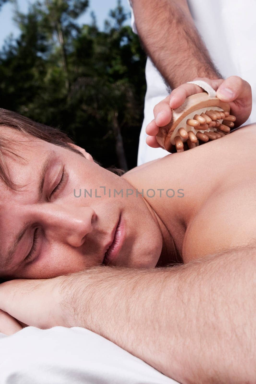 Man receiving acupressure treatment