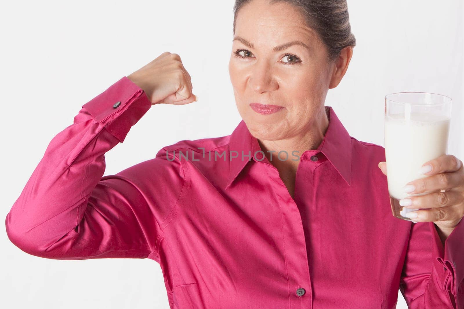 Woman holding a glass of milk