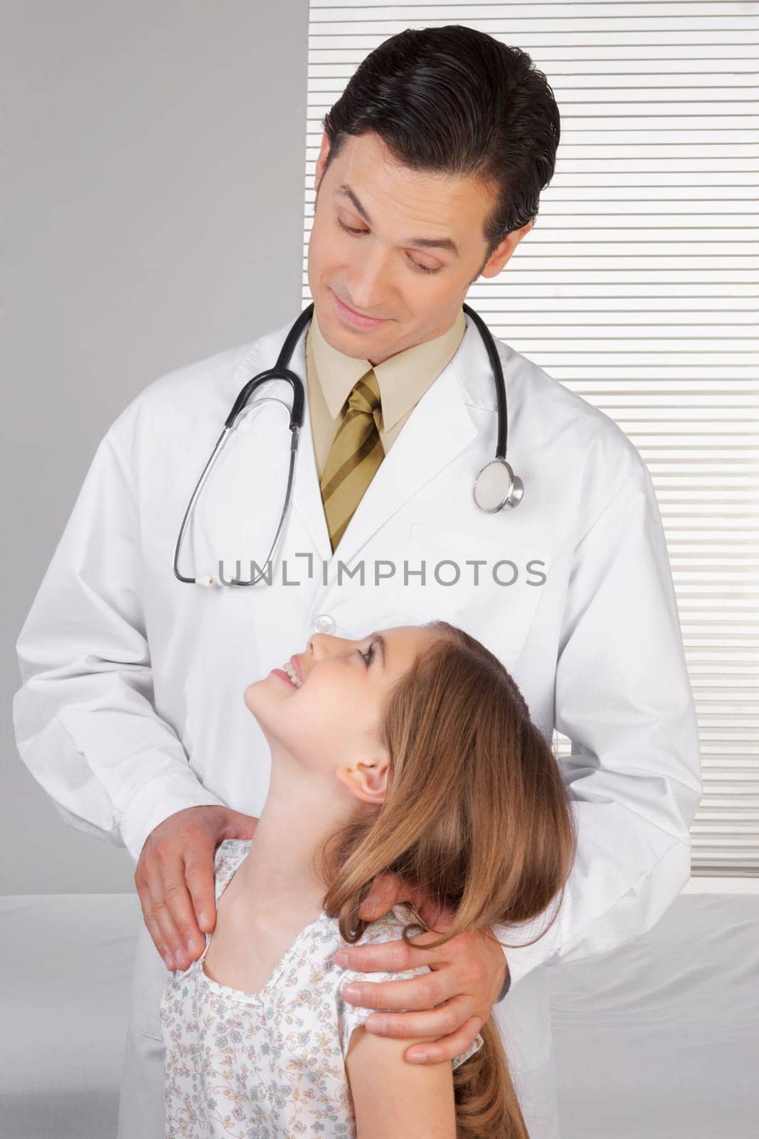 Doctor and a girl looking at each other