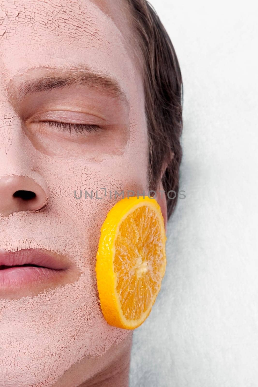 Orange slices on a manŽs face