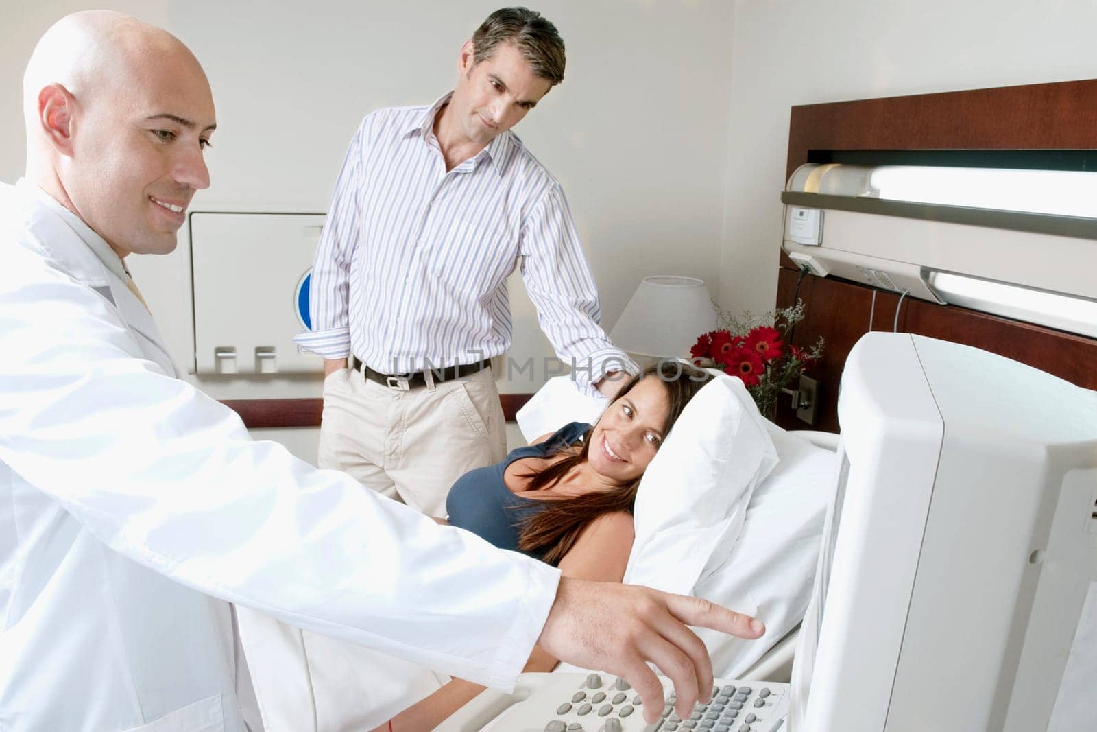 Pregnant woman going through an ultrasound scan