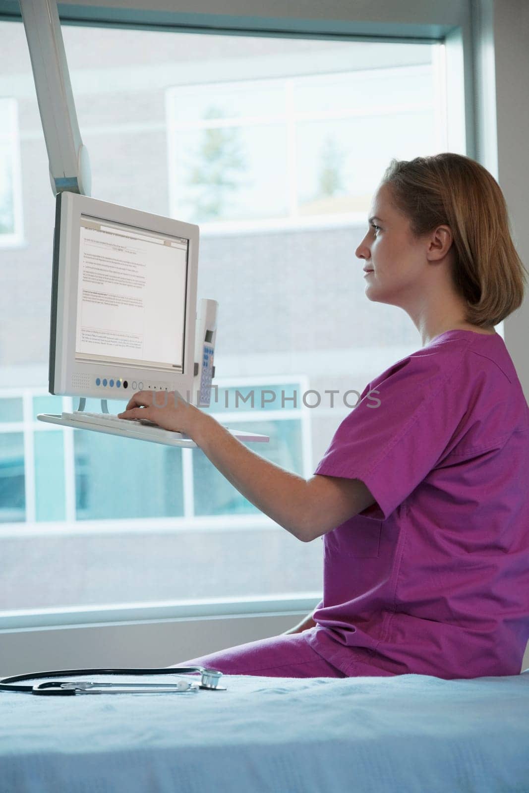 Female doctor working on a computer