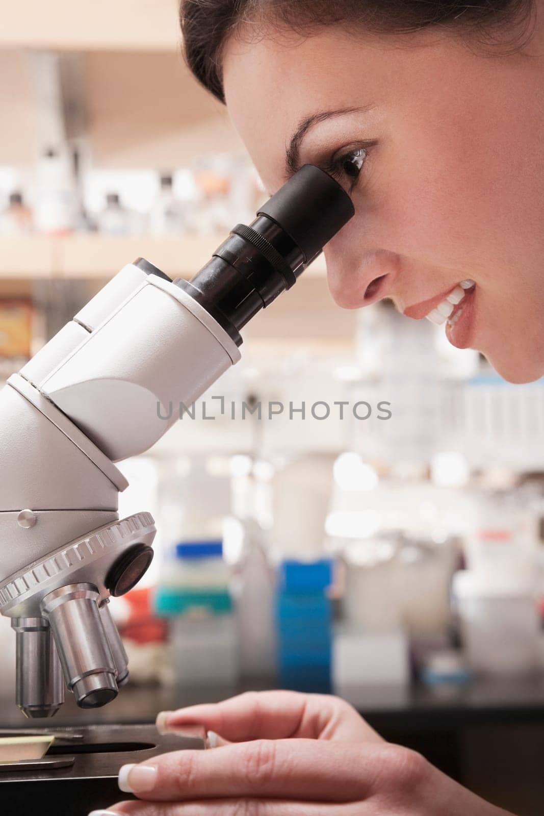 Female doctor working on a microscope in a laboratory