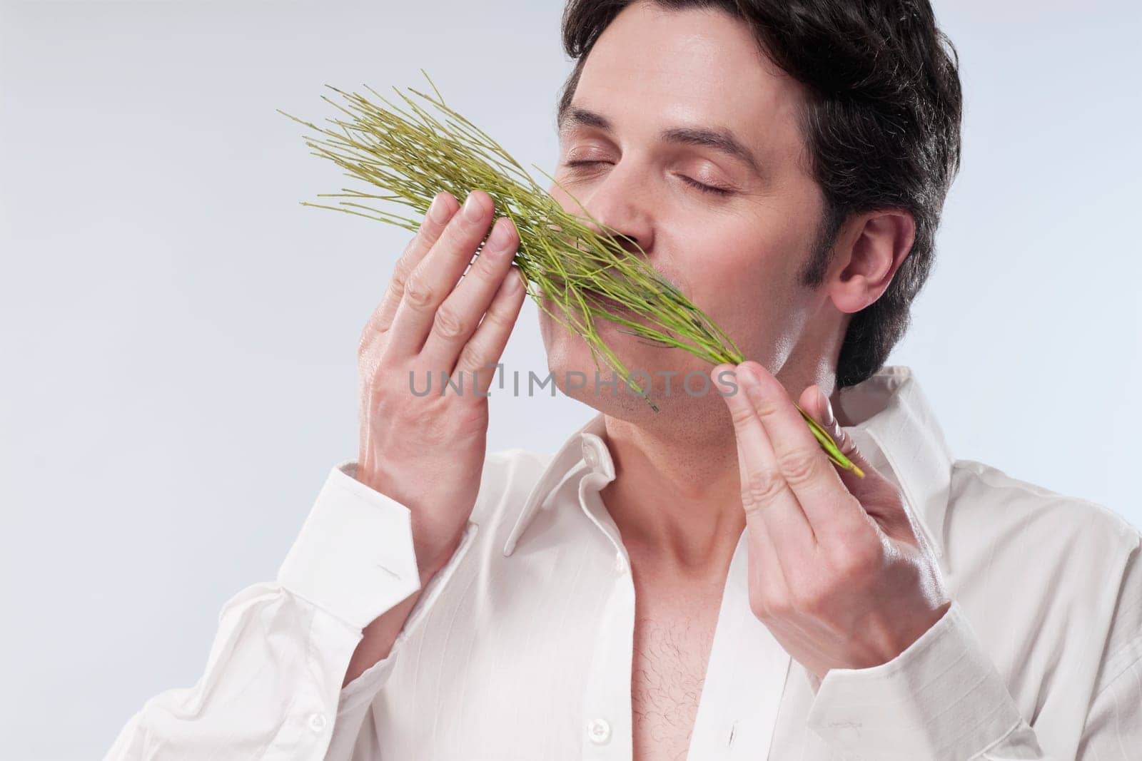 Man smelling aroma herbs