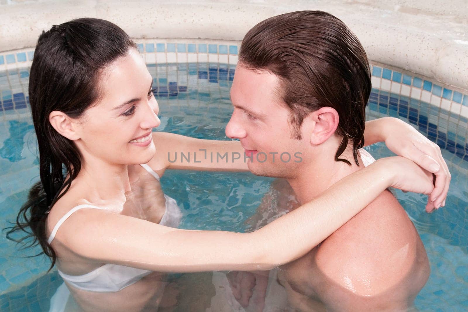 Couple romancing in a hot tub