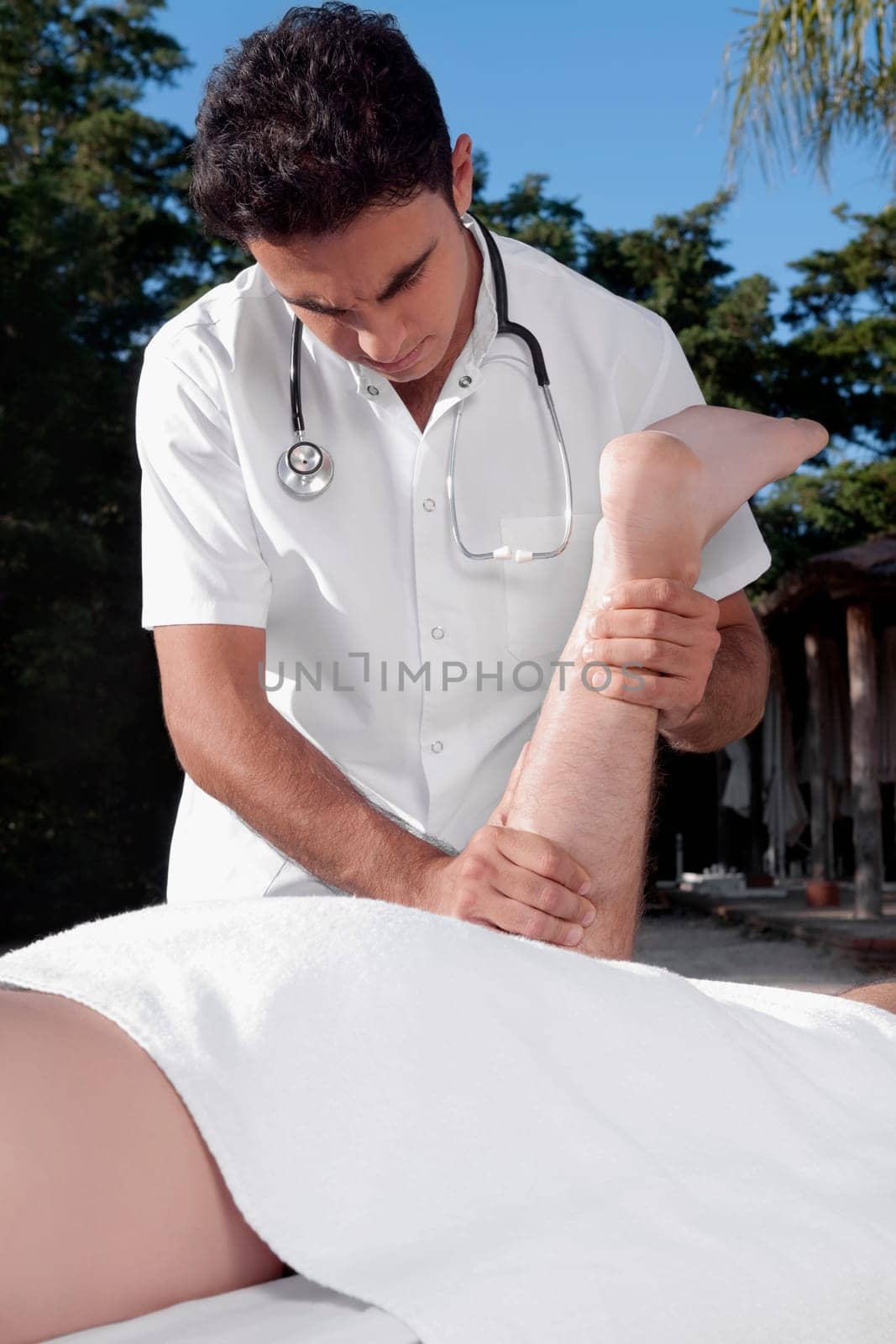 Man receiving a massage from a massage therapist