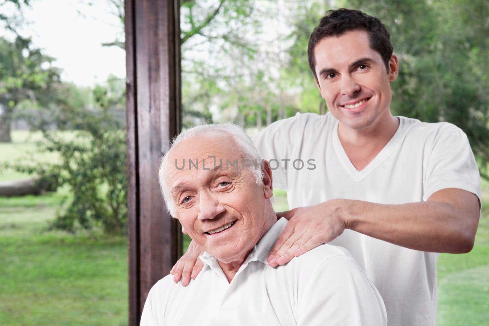 Massage therapist massaging a manŽs neck