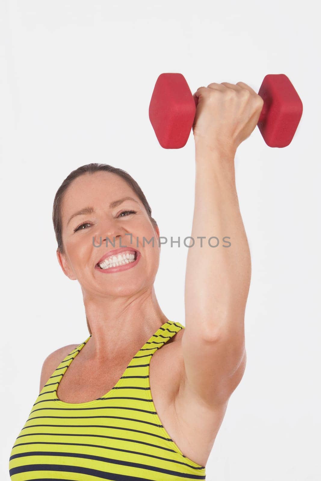 Portrait of a woman exercising with a dumbbell