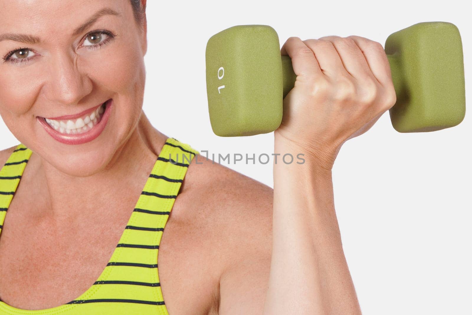 Portrait of a woman exercising with a dumbbell