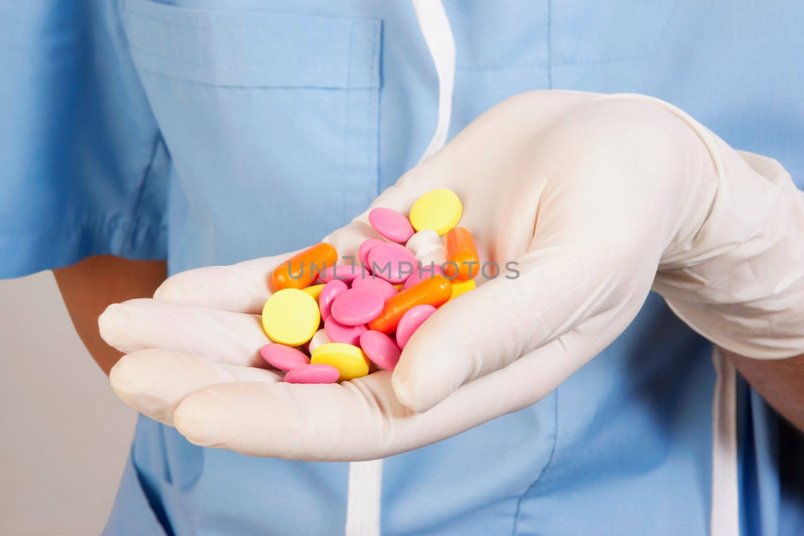 PersonŽs hand holding pills