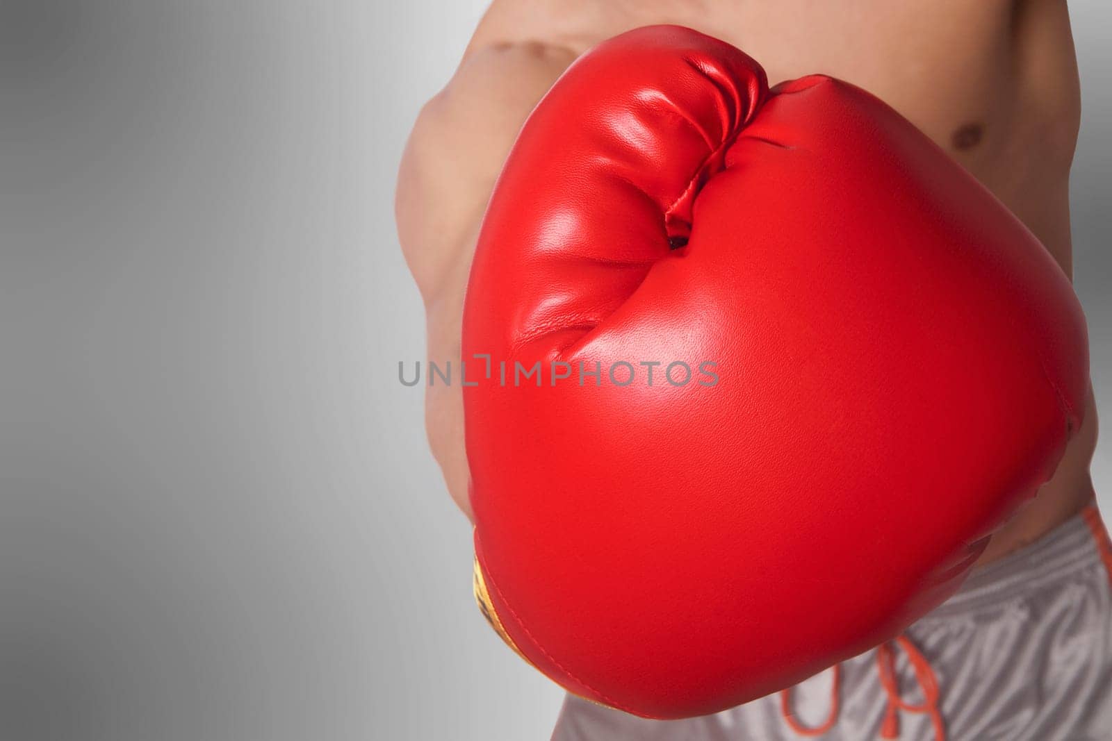 Mid section view of a man in boxing stance