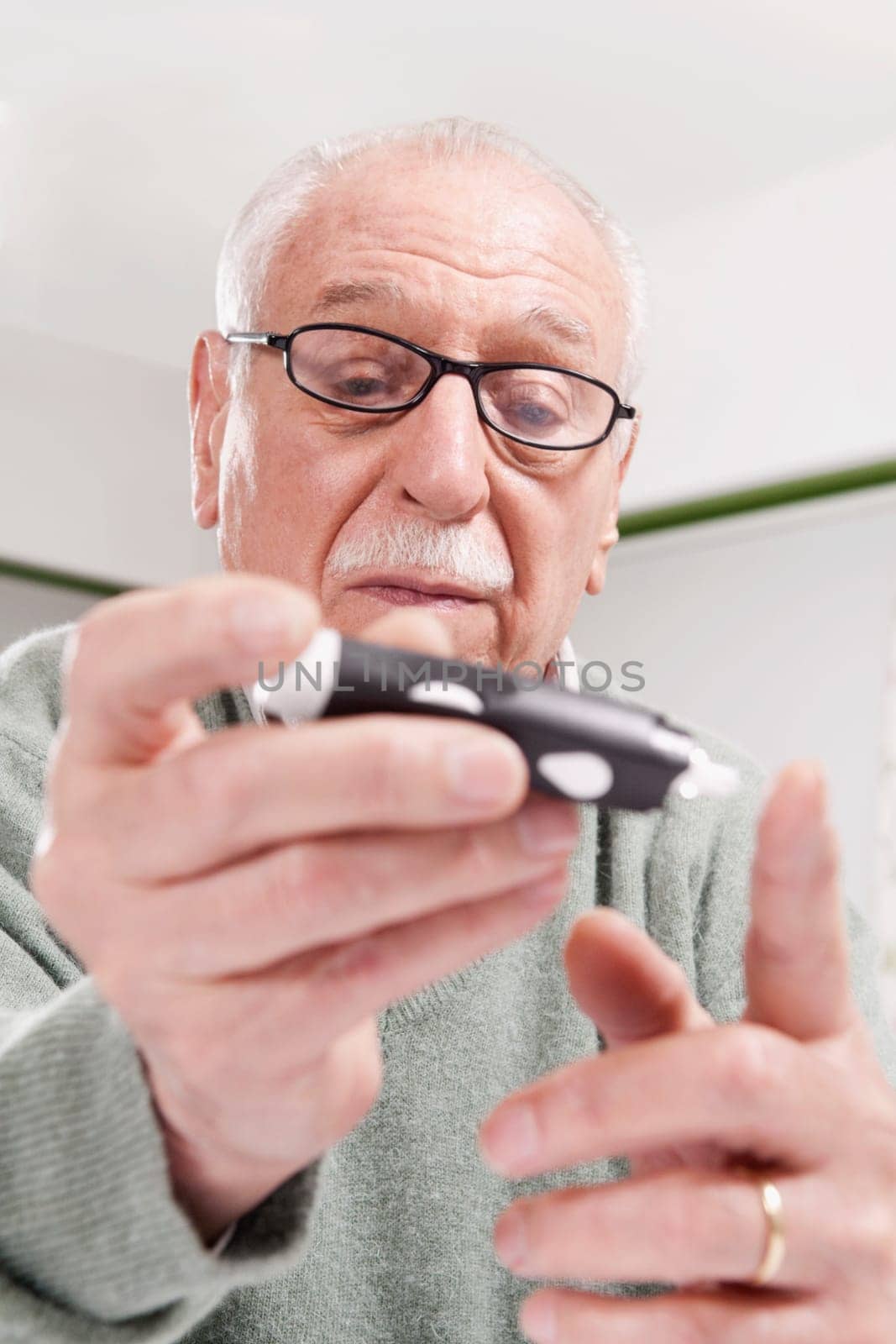 Man testing his blood sugar level