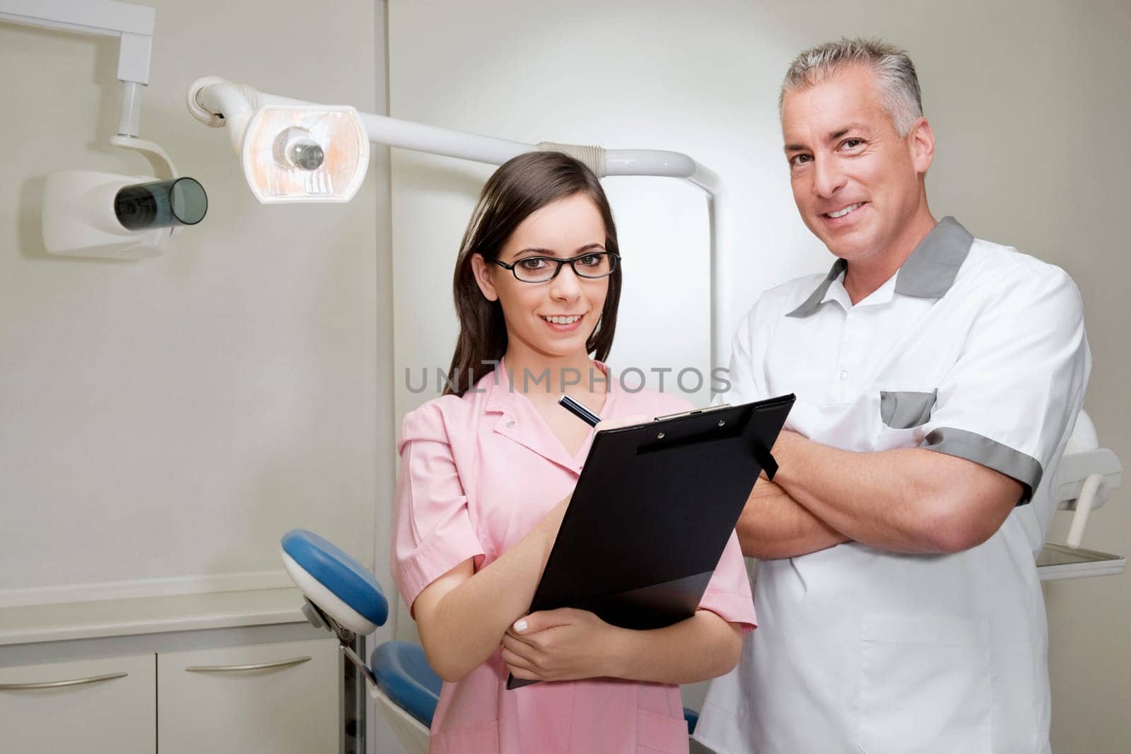 Portrait of two dentists smiling