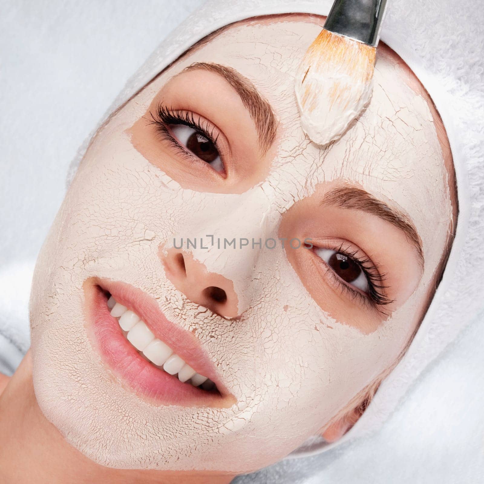 Woman applying face pack