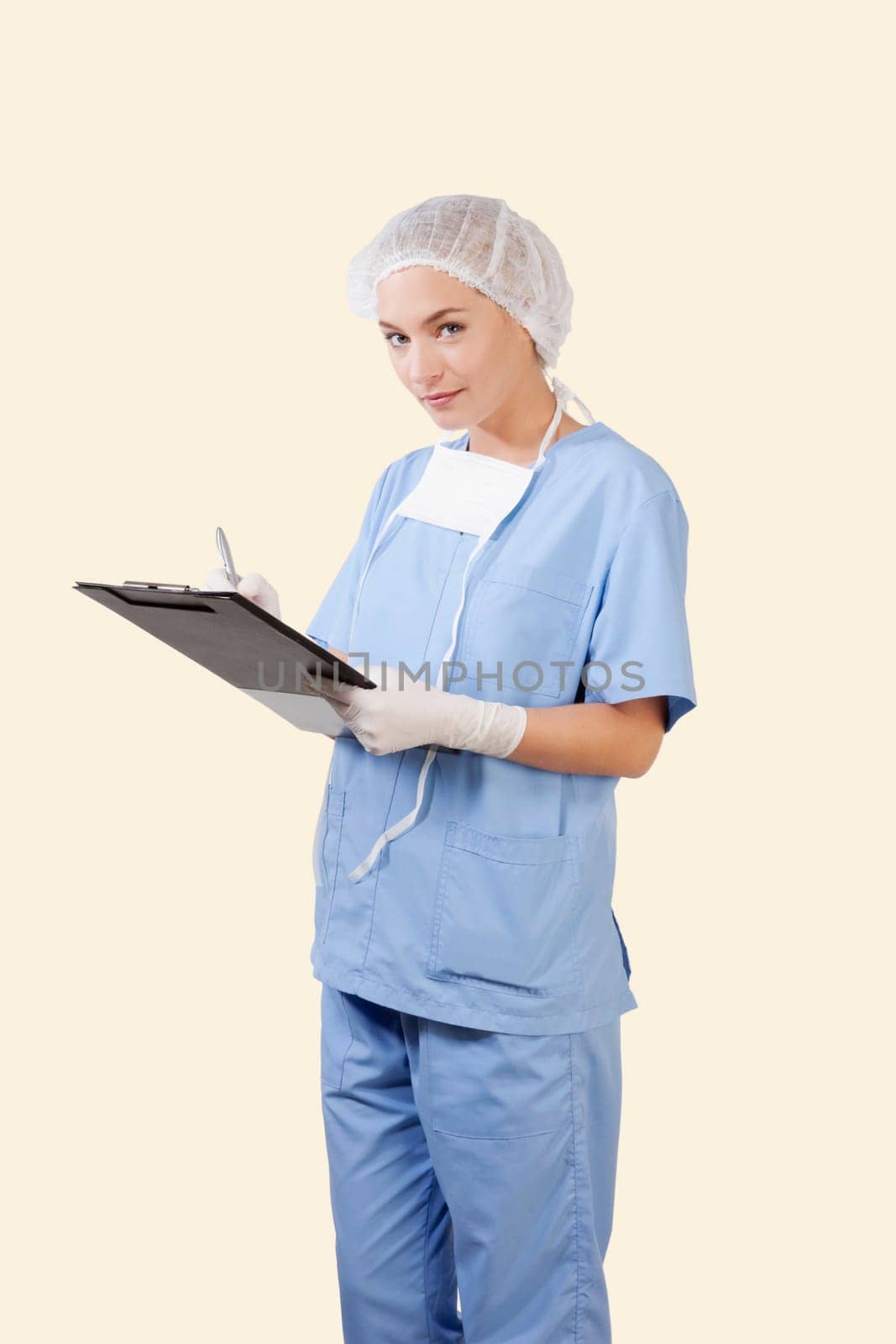 Female surgeon holding a clipboard