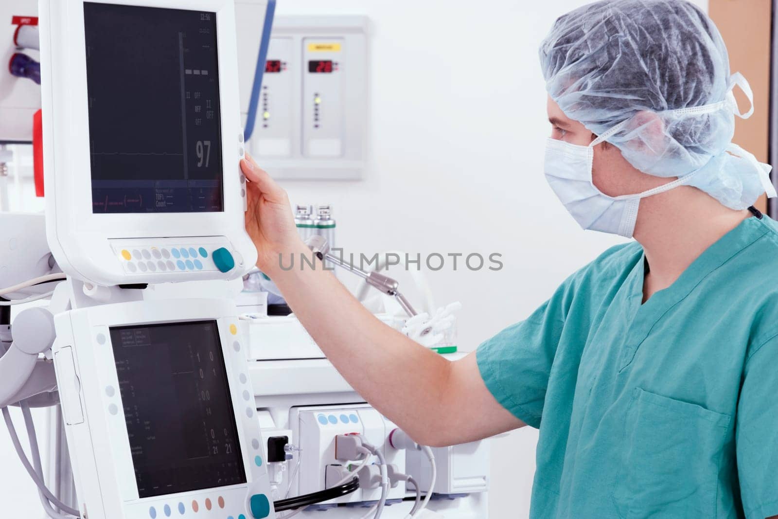 Doctor working on a cardiac monitor screen
