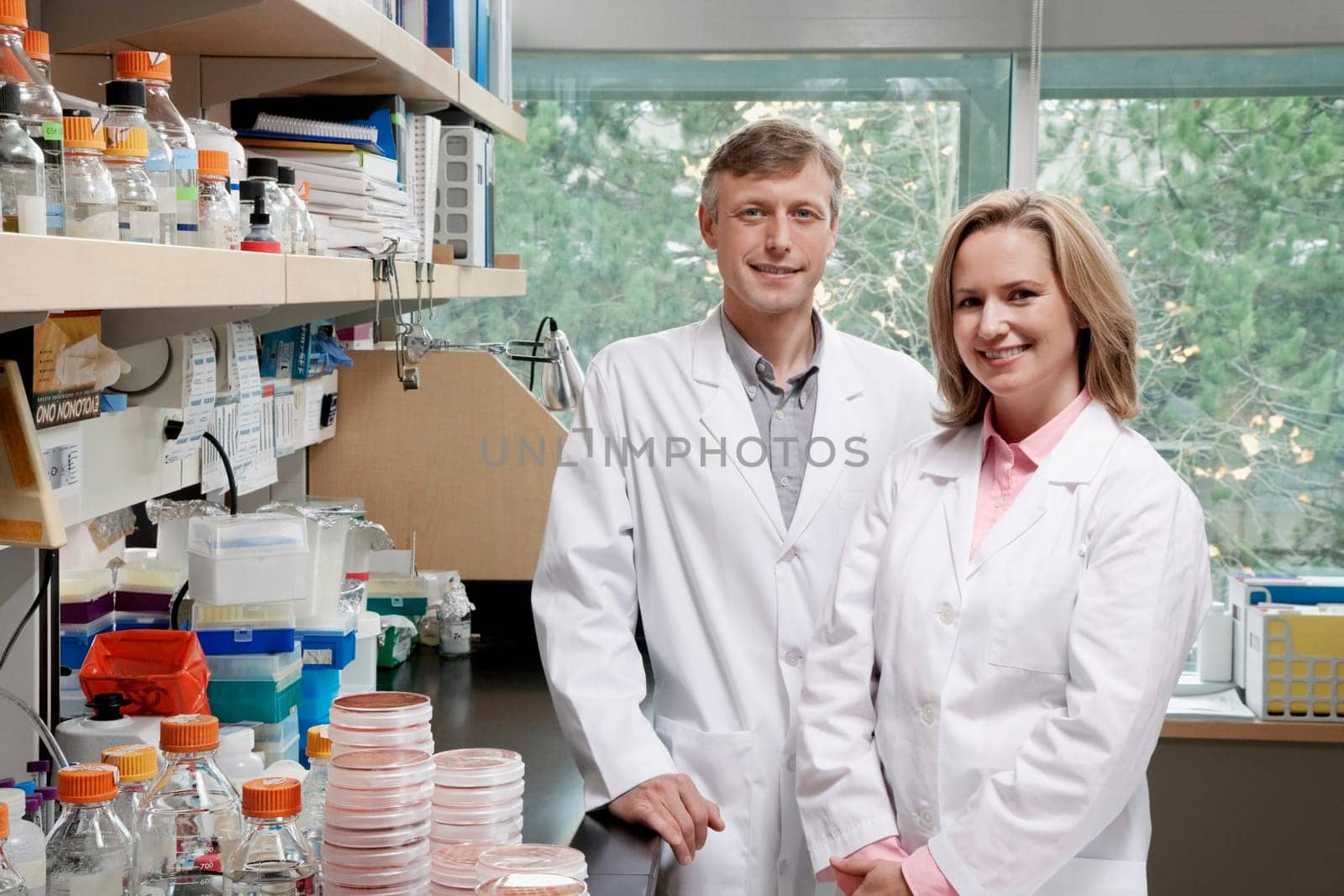 Portrait of two doctors smiling in a laboratory