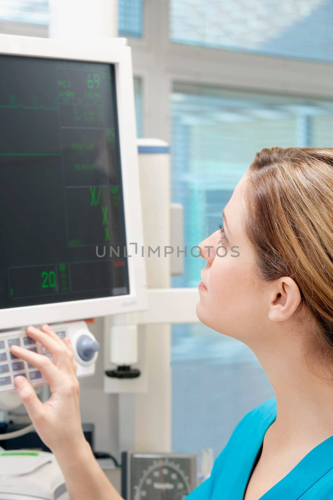 Female doctor working on a cardiac monitor