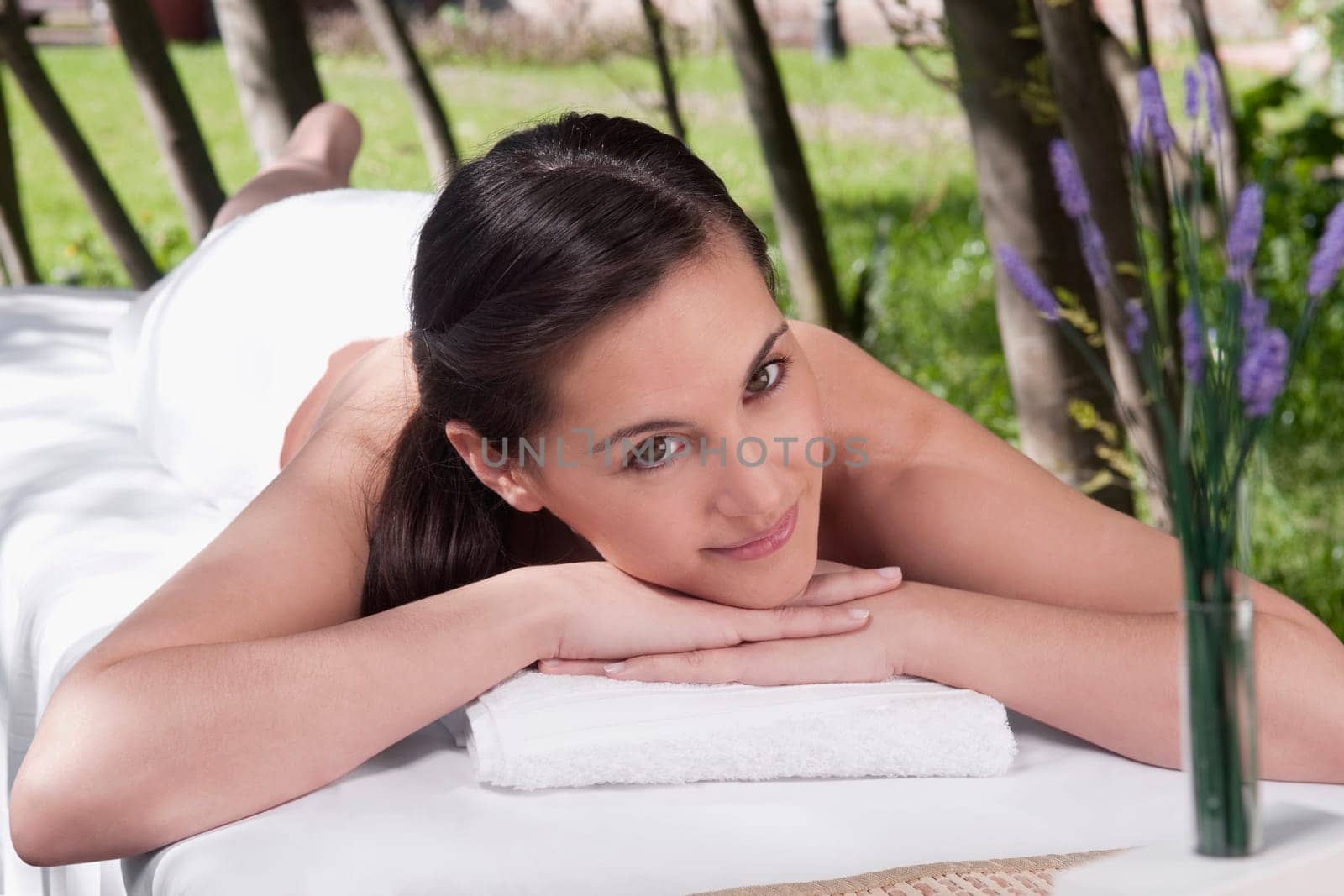 Portrait of a woman lying on a massage table