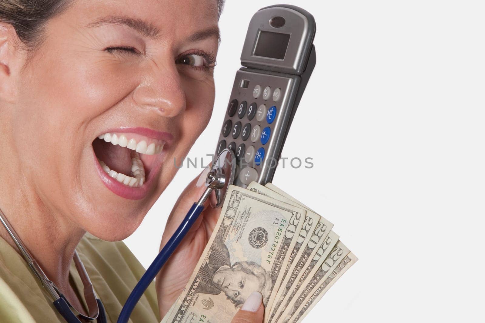 Doctor holding a calculator and currency notes