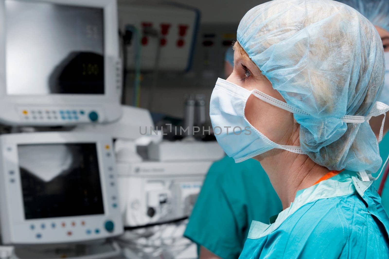 Female doctor working on a cardiac monitor