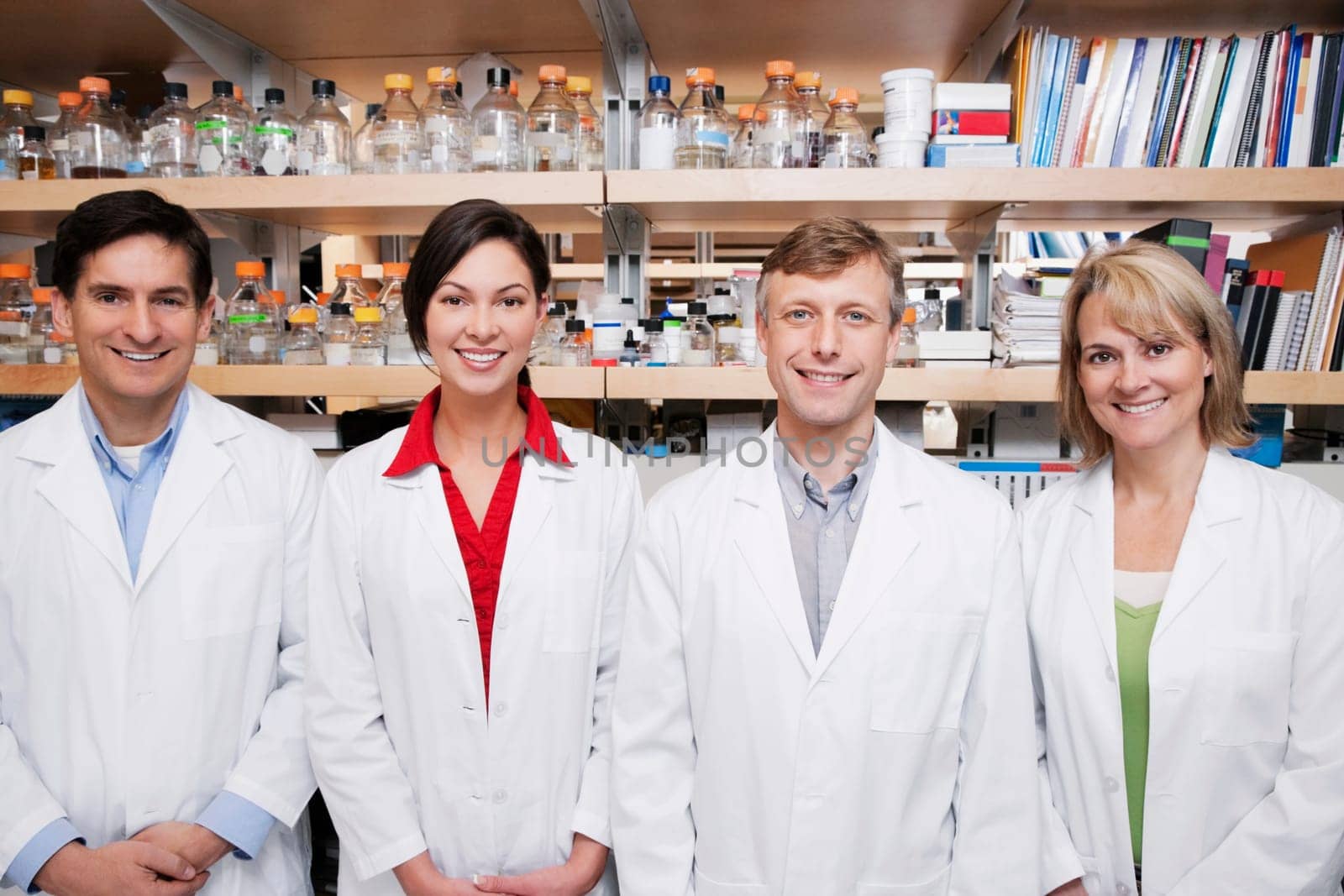 Portrait of four doctors smiling in a laboratory