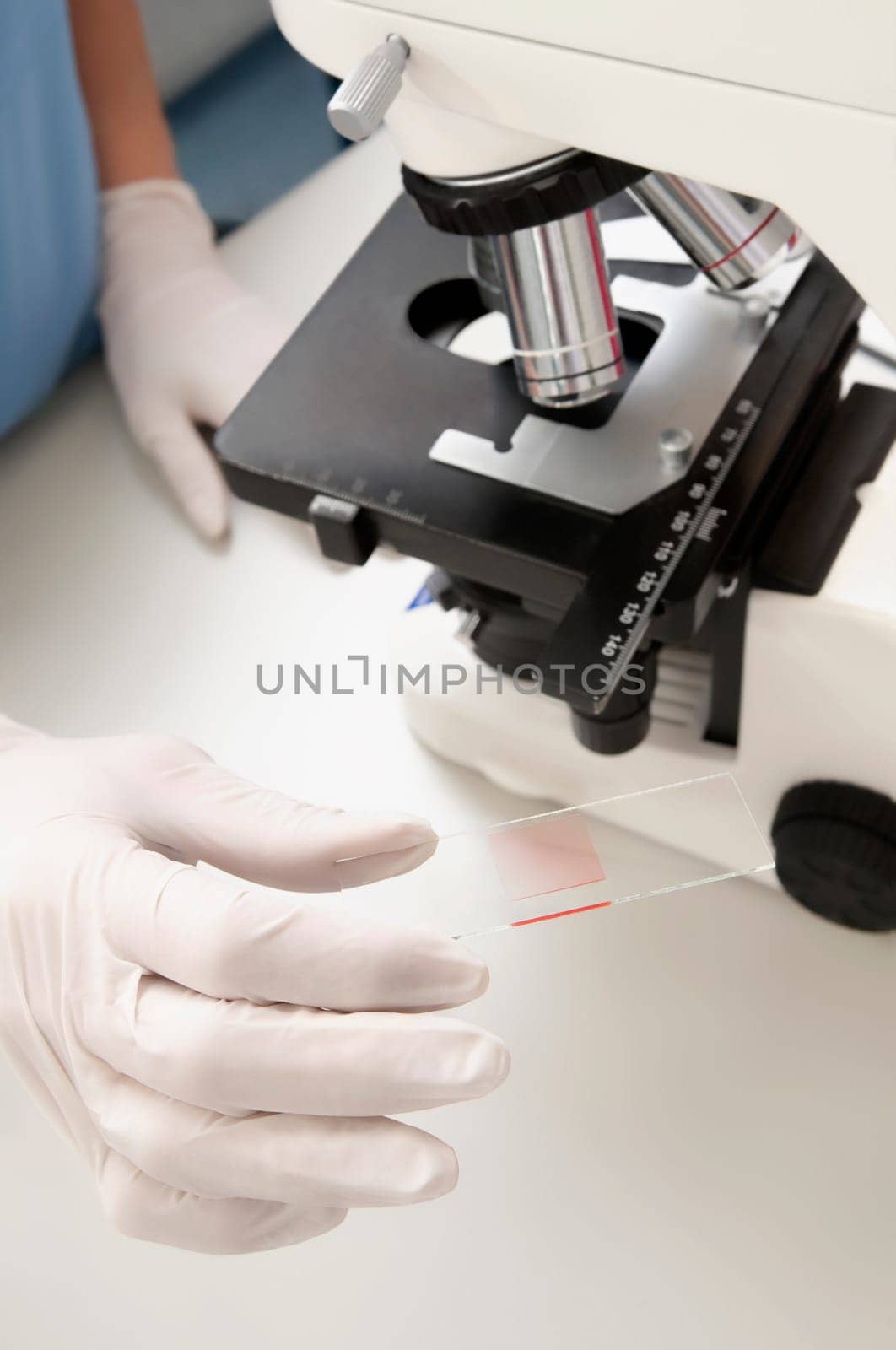 Female lab technician analyzing a sample in a laboratory
