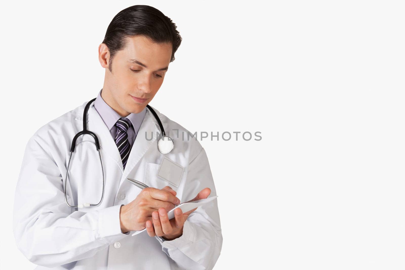 Close_up of a doctor doing paperwork