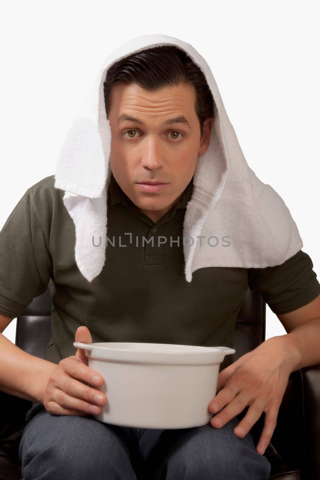 Portrait of a man inhaling steam
