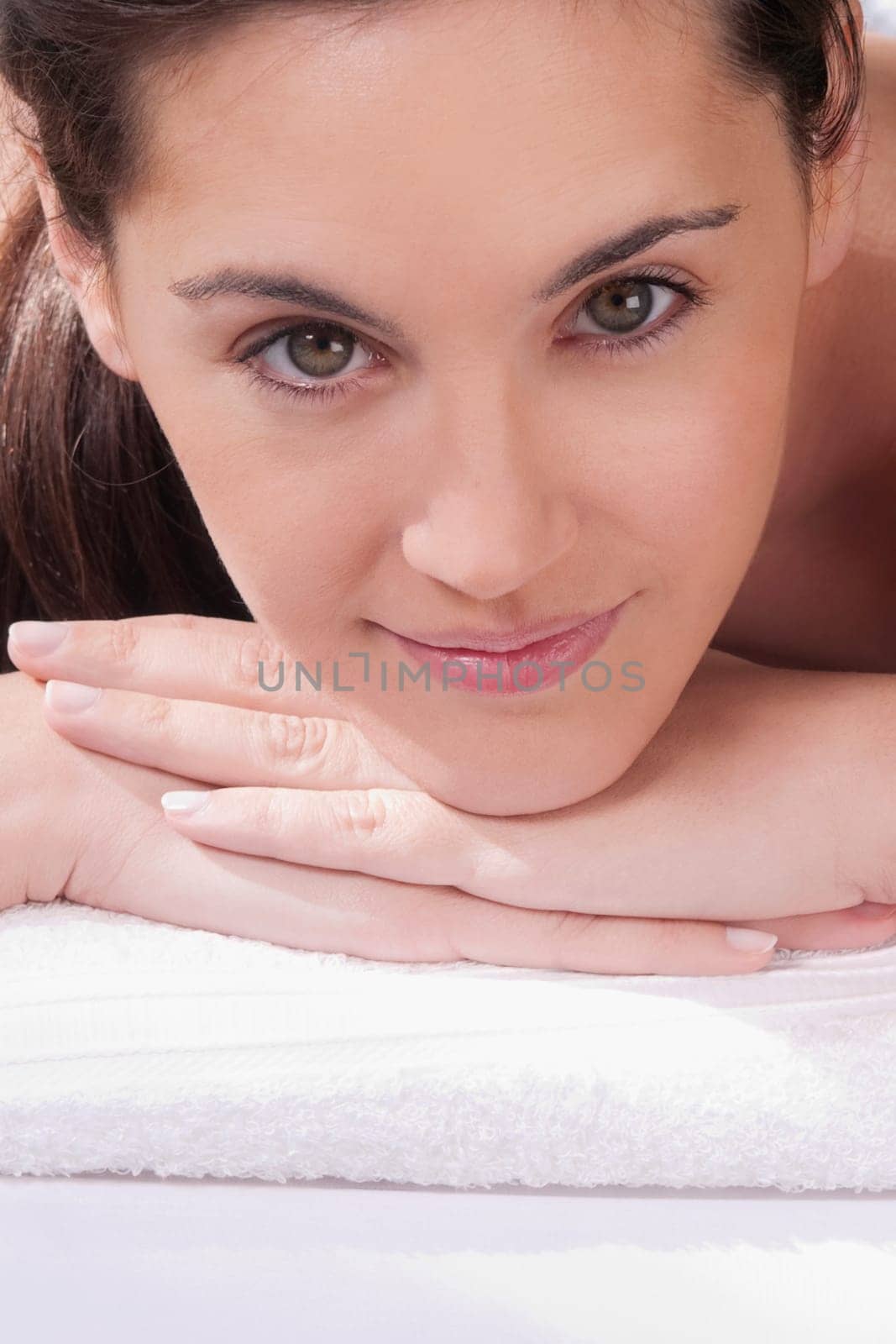 Portrait of a woman lying on a massage table