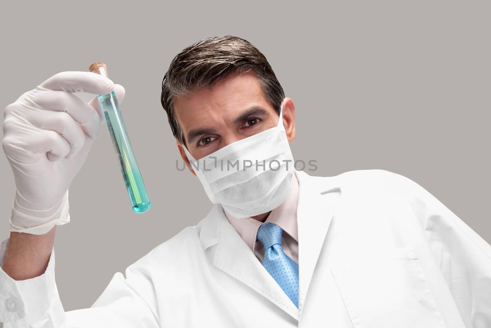 Lab technician analyzing sample in a test tube