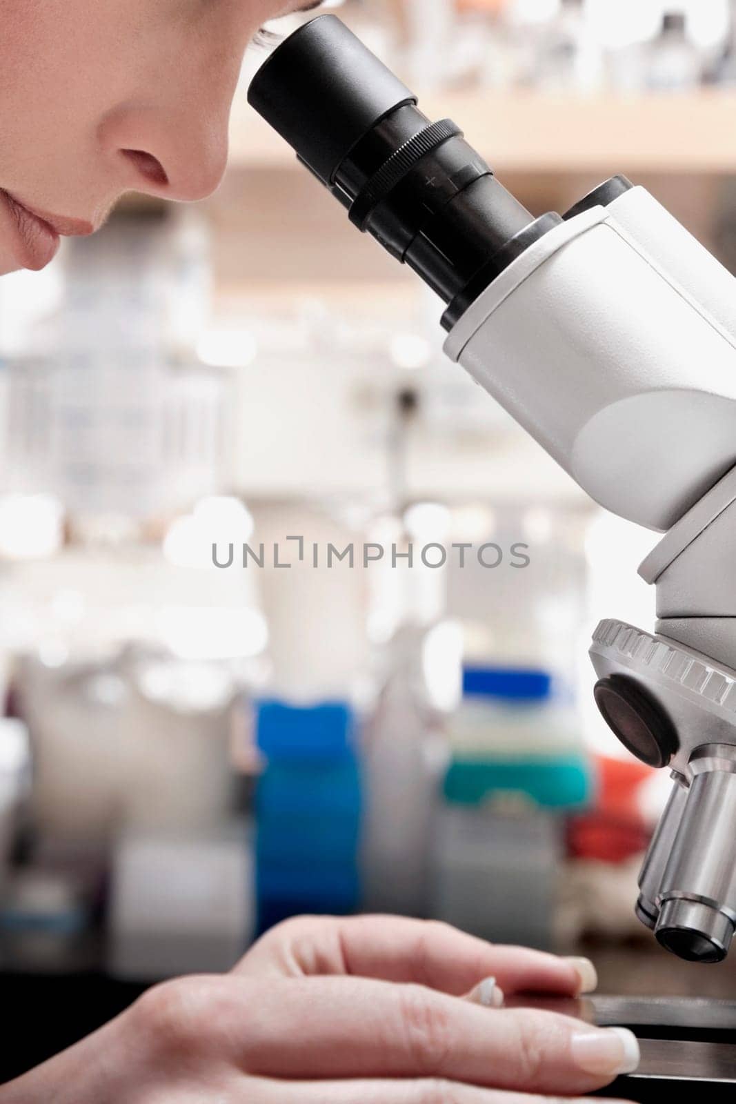 Female doctor working on a microscope in a laboratory