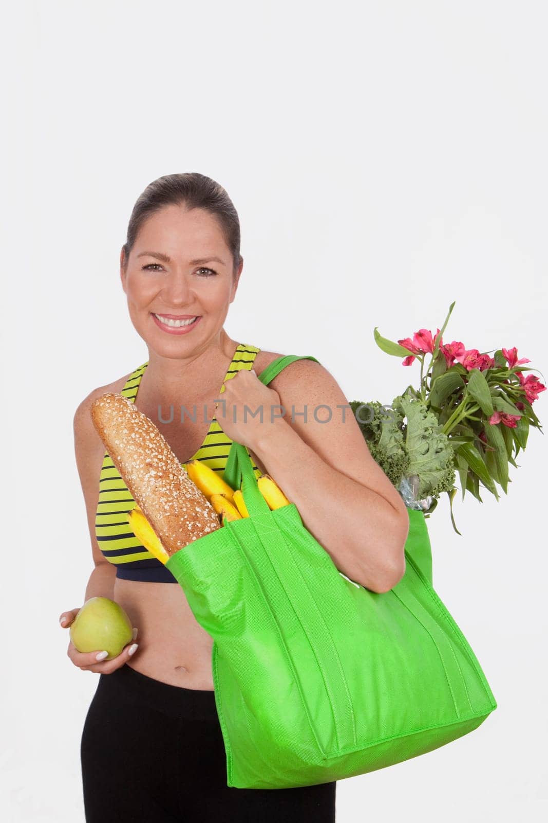 Woman carrying a bag of groceries