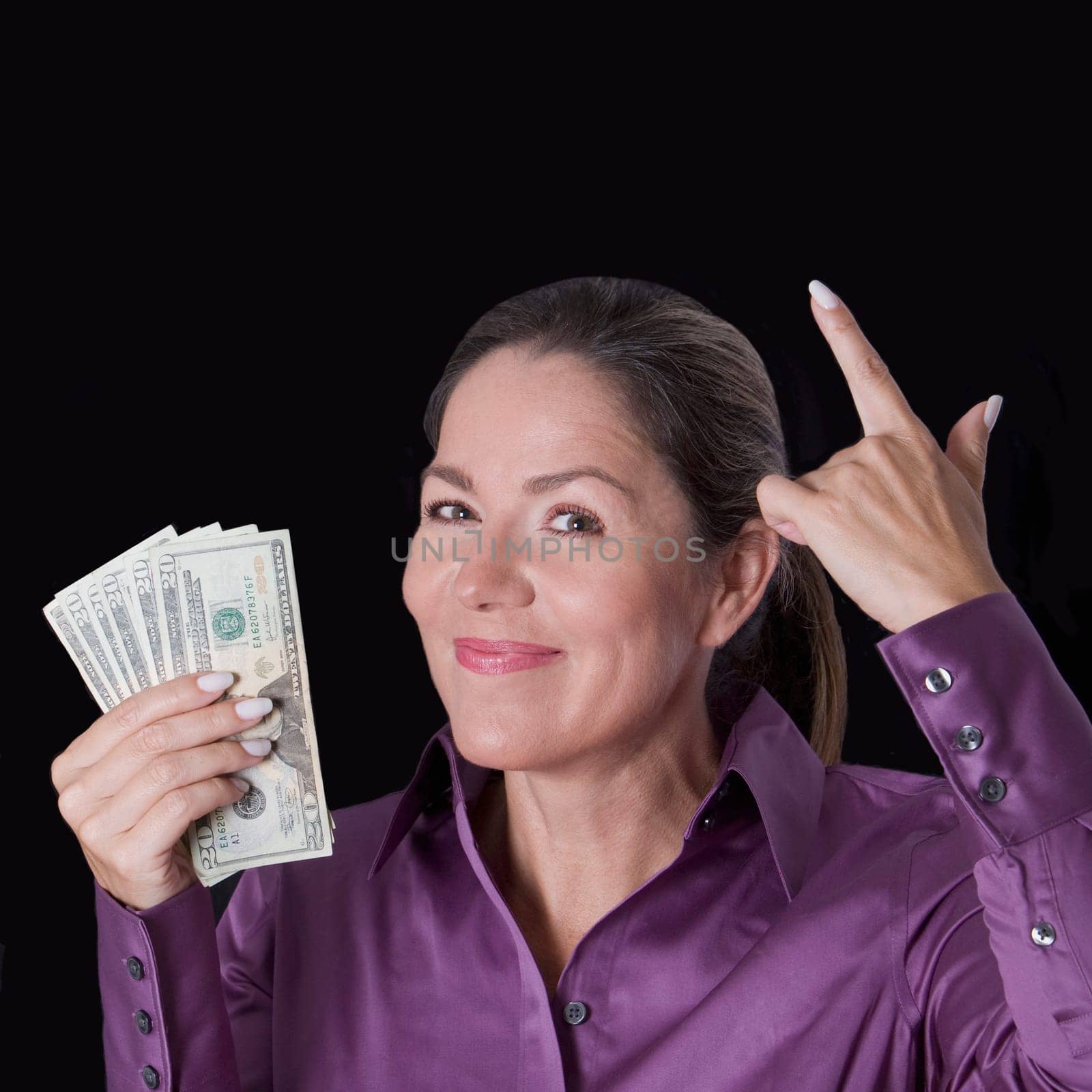 Woman holding currency notes