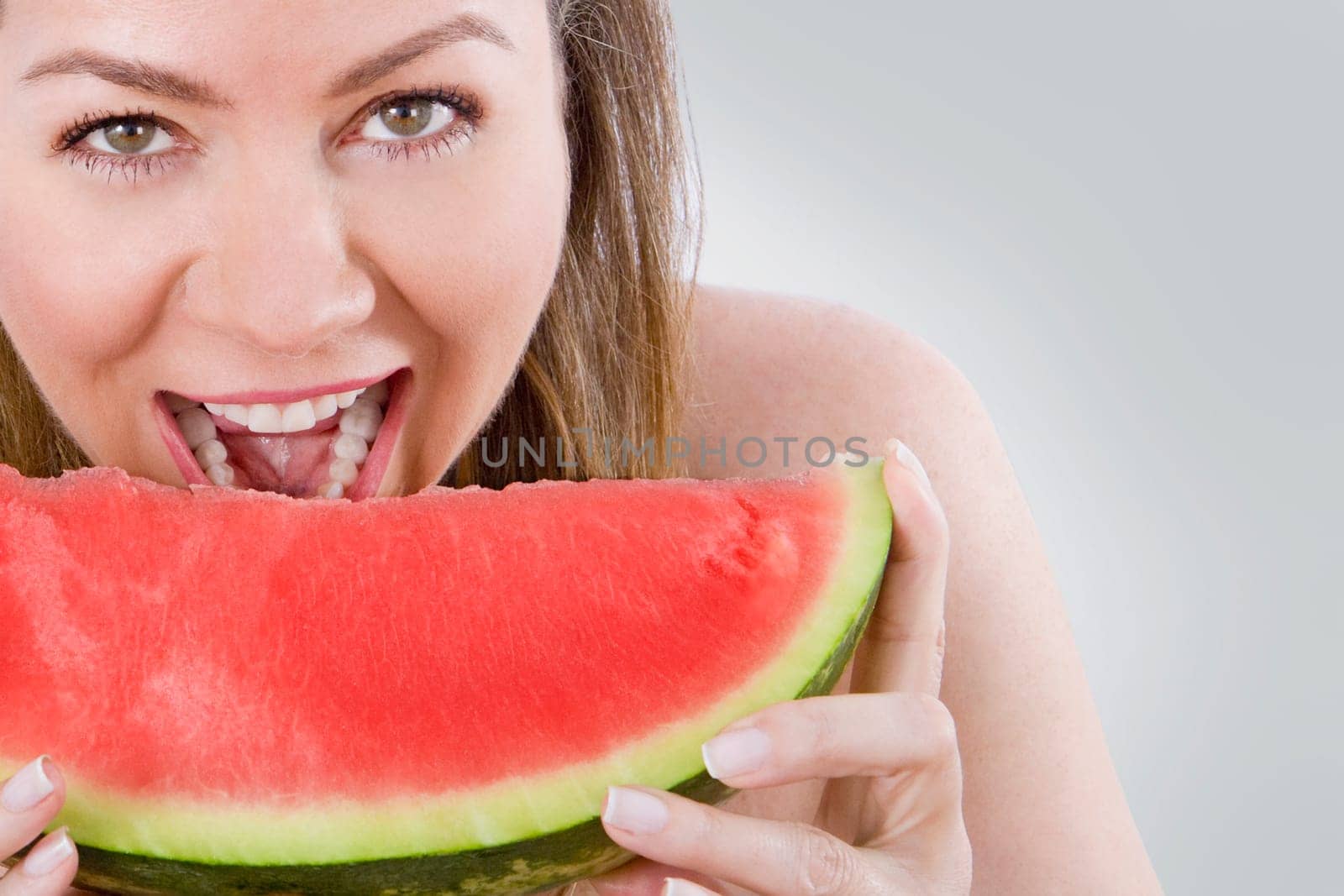 Woman eating watermelon