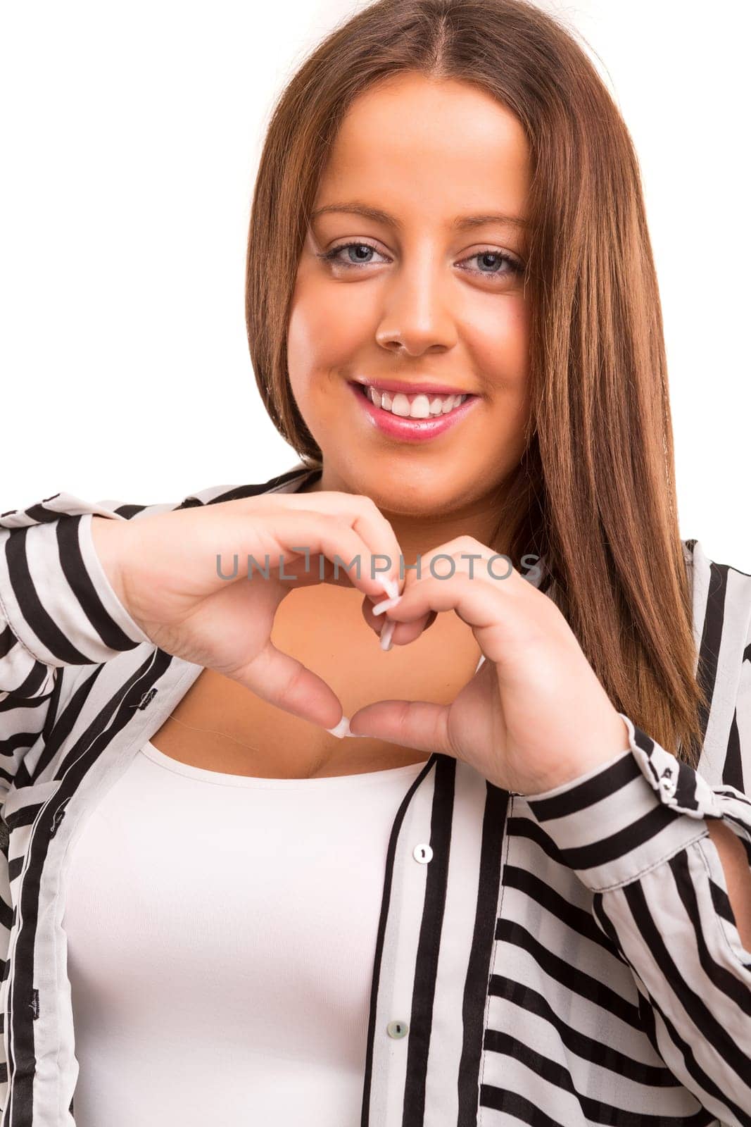 Large woman making a heart shape with her hands, isolated over white background