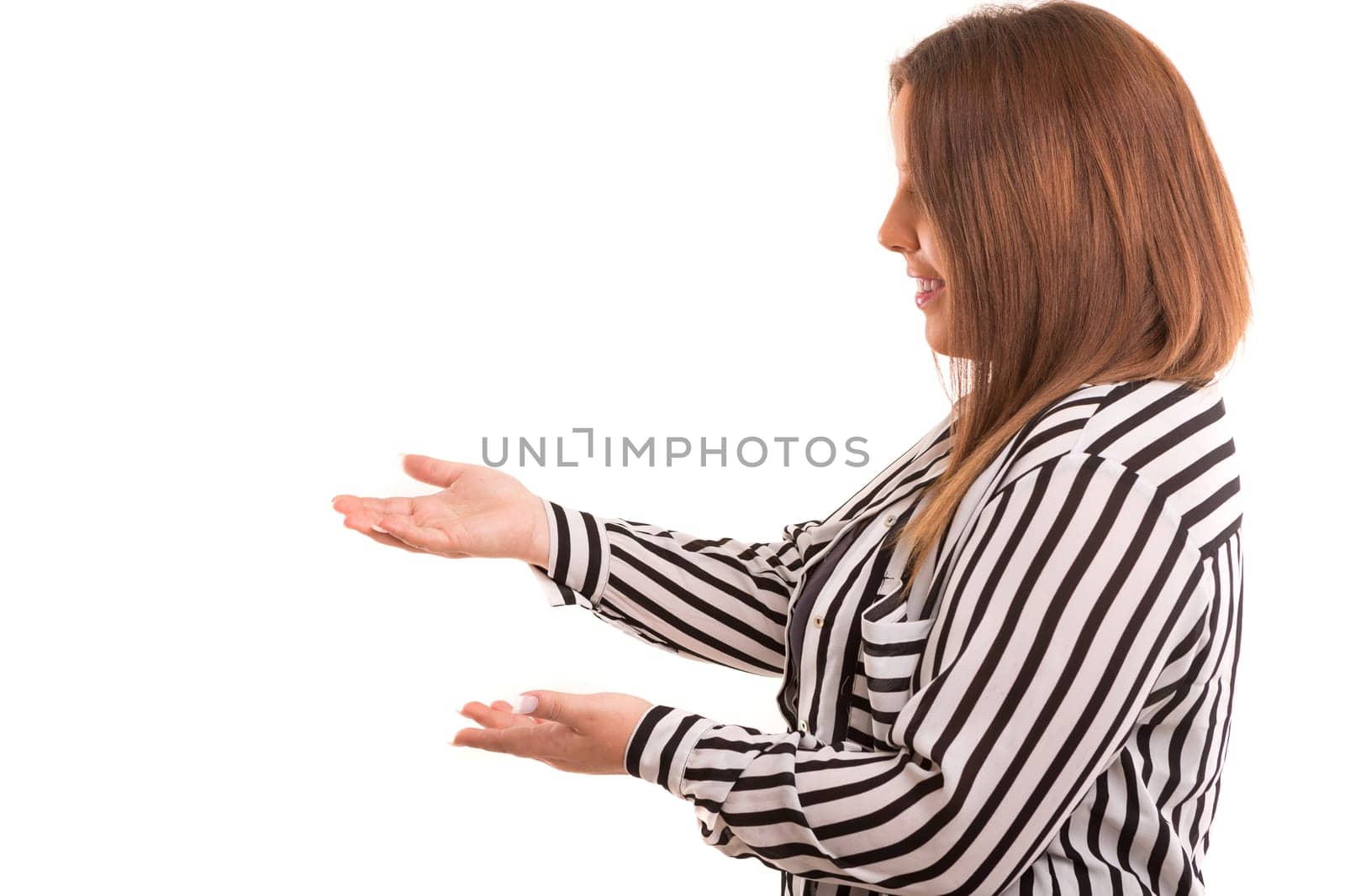 Young large beautiful woman presenting your product, isolated over white background