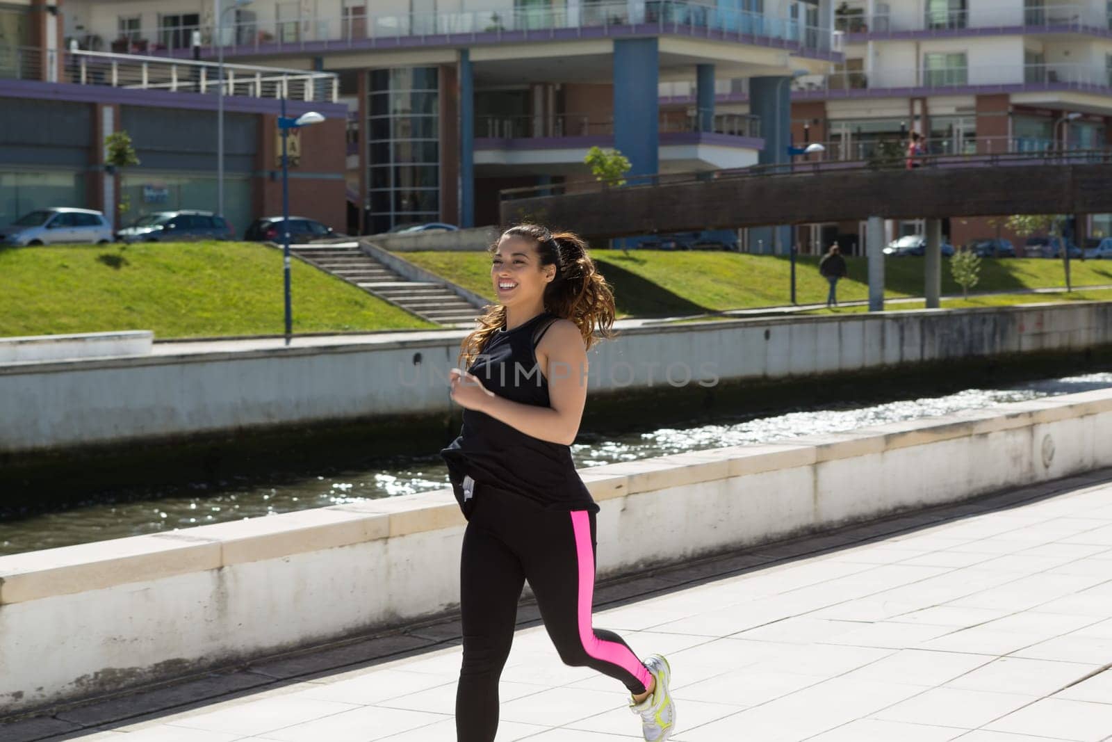 A beautiful young woman making some exercise at the park - fitness concept