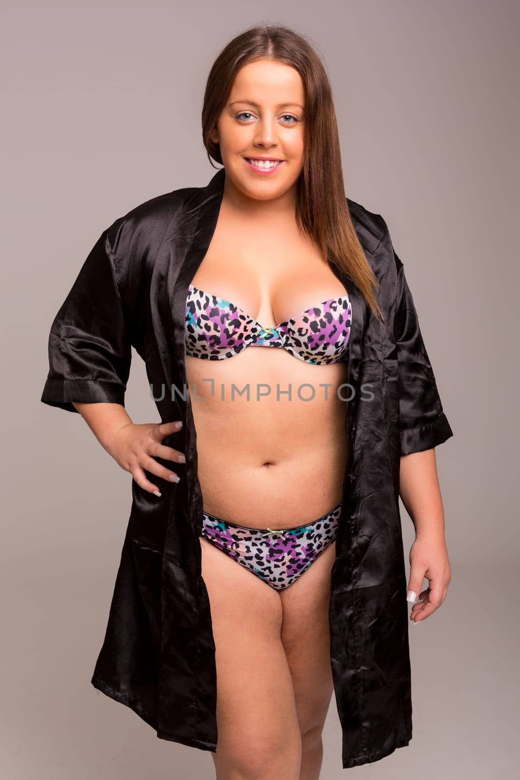 Beautiful large woman posing in lingerie - studio shot