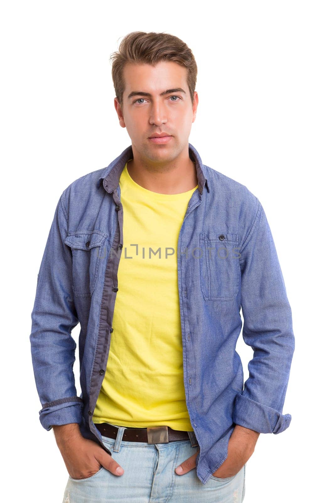 Studio picture of a young and handsome man posing isolated